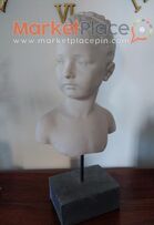 Bust of a girl.